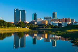 Fort Worth skyline with the Trinity River in the foreground.